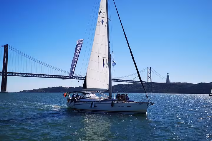 Luxury sailing yacht on Lisbon Tagus River near 25 de Abril Bridge, scenic tour with 2 drinks included