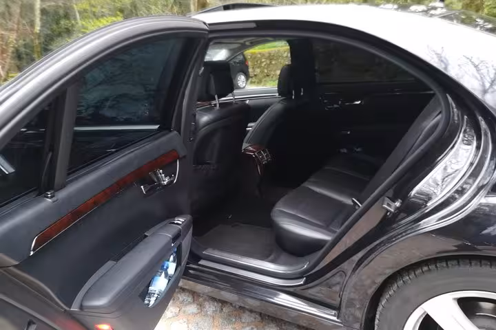 Luxury sedan interior for Lisbon airport transfer, comfortable private shuttle from Lisbon Airport to city center or return