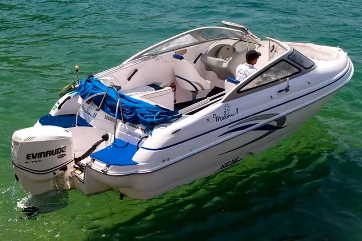Luxury speedboat on crystal-clear waters in Paraty, perfect for an exclusive boat tour experience.