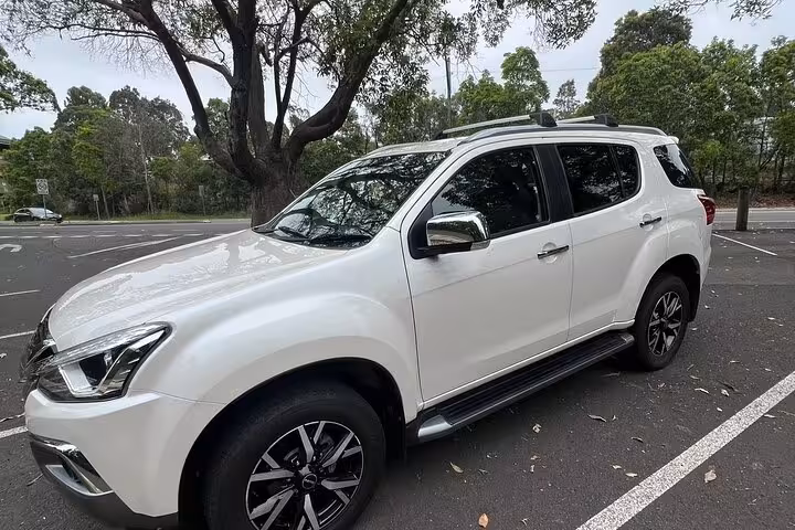 Luxury SUV ready for pickup service on Blue Mountains Winery Tasting Private Tour, offering comfort and style.