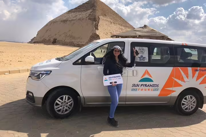 Private tour van at Giza Plateau with pyramid backdrop, luxury transfer for Giza Saqqara Dahshur day trip