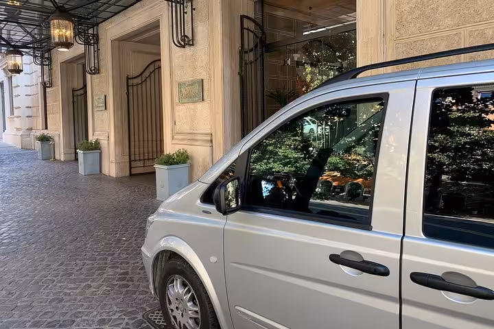 Luxury van parked outside elegant hotel in Sorrento, perfect for private guided Amalfi Coast day trips.