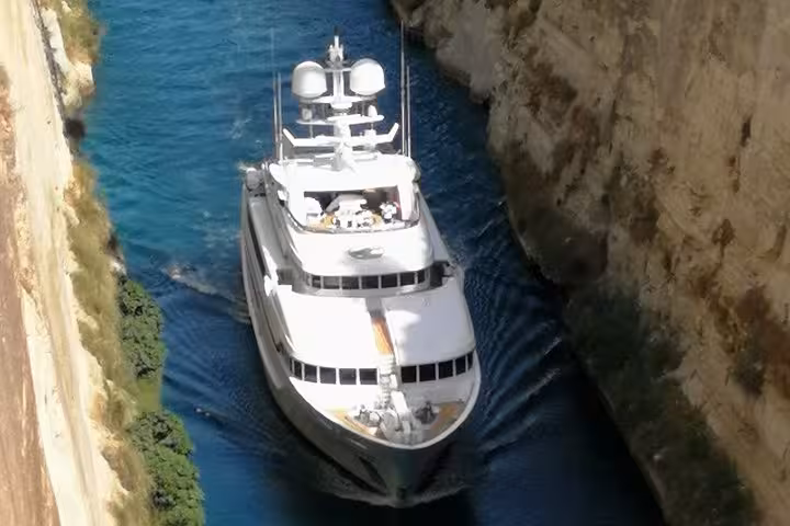 Luxury yacht cruising through the Corinth Canal, iconic photo stop on private Nafplio Epidaurus tour