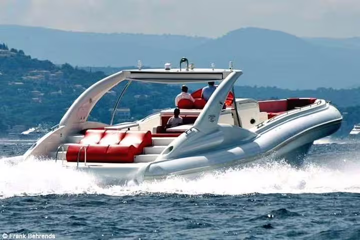 Elegant yacht cruising through ocean waves, offering premium whale and dolphin watching experience.