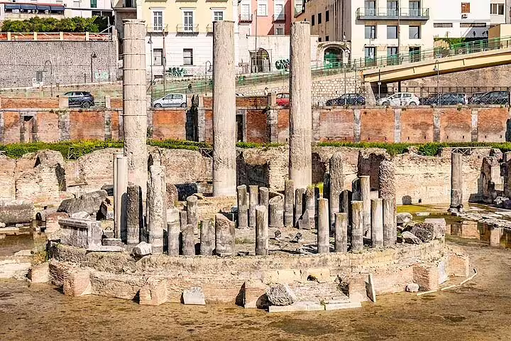 Macellum of Pozzuoli ruins with ancient Roman columns and flooded arena on a private day trip from Naples to Phlegraean Fields