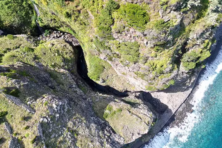 Aerial view of Madeira's rugged cliffs and coastal landscape, perfect for a full-day private 4x4 adventure tour.