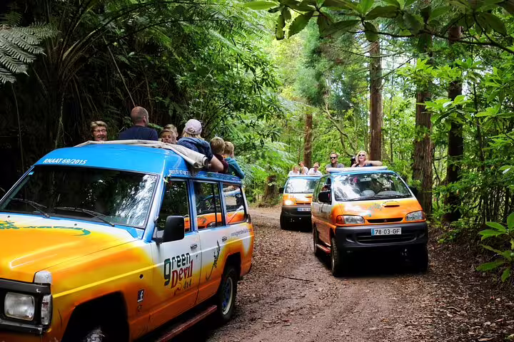 Tourists enjoy an adventurous 4x4 ride through lush Madeira forest, part of an all-in-one experience including hiking and boat trips.