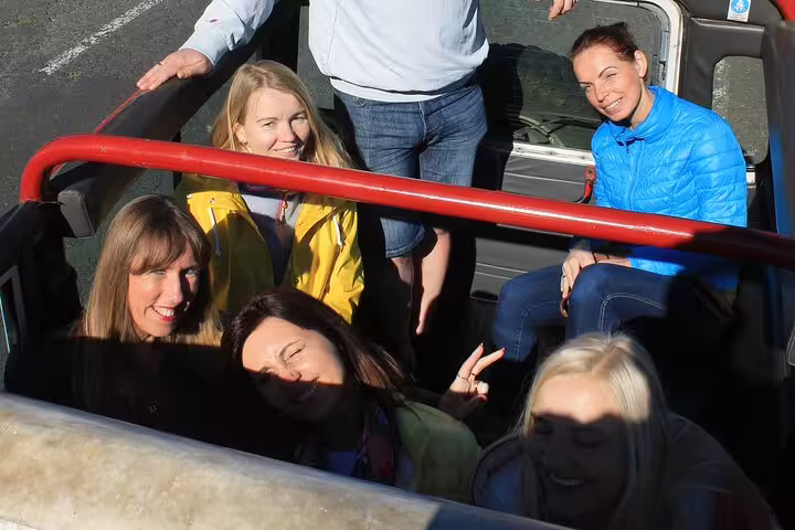 Group enjoying a sunny 4x4 adventure in Madeira, perfect for exploring scenic routes before a skywalk with wine and tapas.