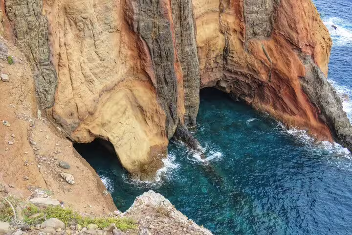 Dramatic coastal cliffs and turquoise waters in Madeira, ideal for 4x4 adventure, hiking, swimming, and boat tours.