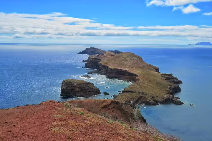Stunning coastal landscape of Madeira with rocky cliffs and blue ocean, ideal for 4x4 rides, hiking, swimming, and boat trips.