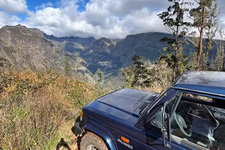 4x4 jeep at Madeira mountain viewpoint on cultural rural off-road tour through rugged valleys and forests