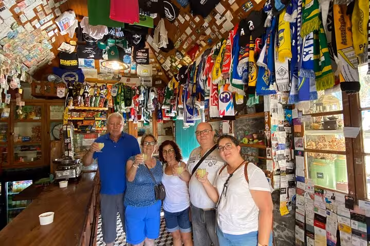 Tour guests tasting poncha in a traditional Madeira bar during the Fanal Forest, Skywalk and lava pools 4x4 tour