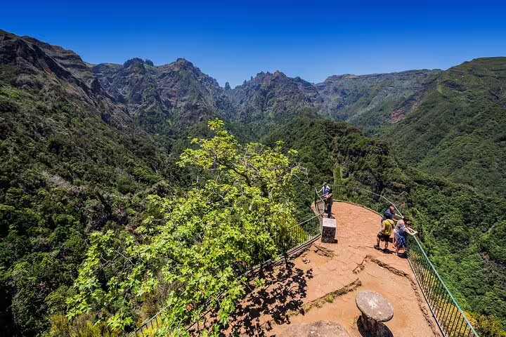 Scenic view from Madeira Island's mountain lookout offering panoramic vistas of lush valleys and dramatic peaks.
