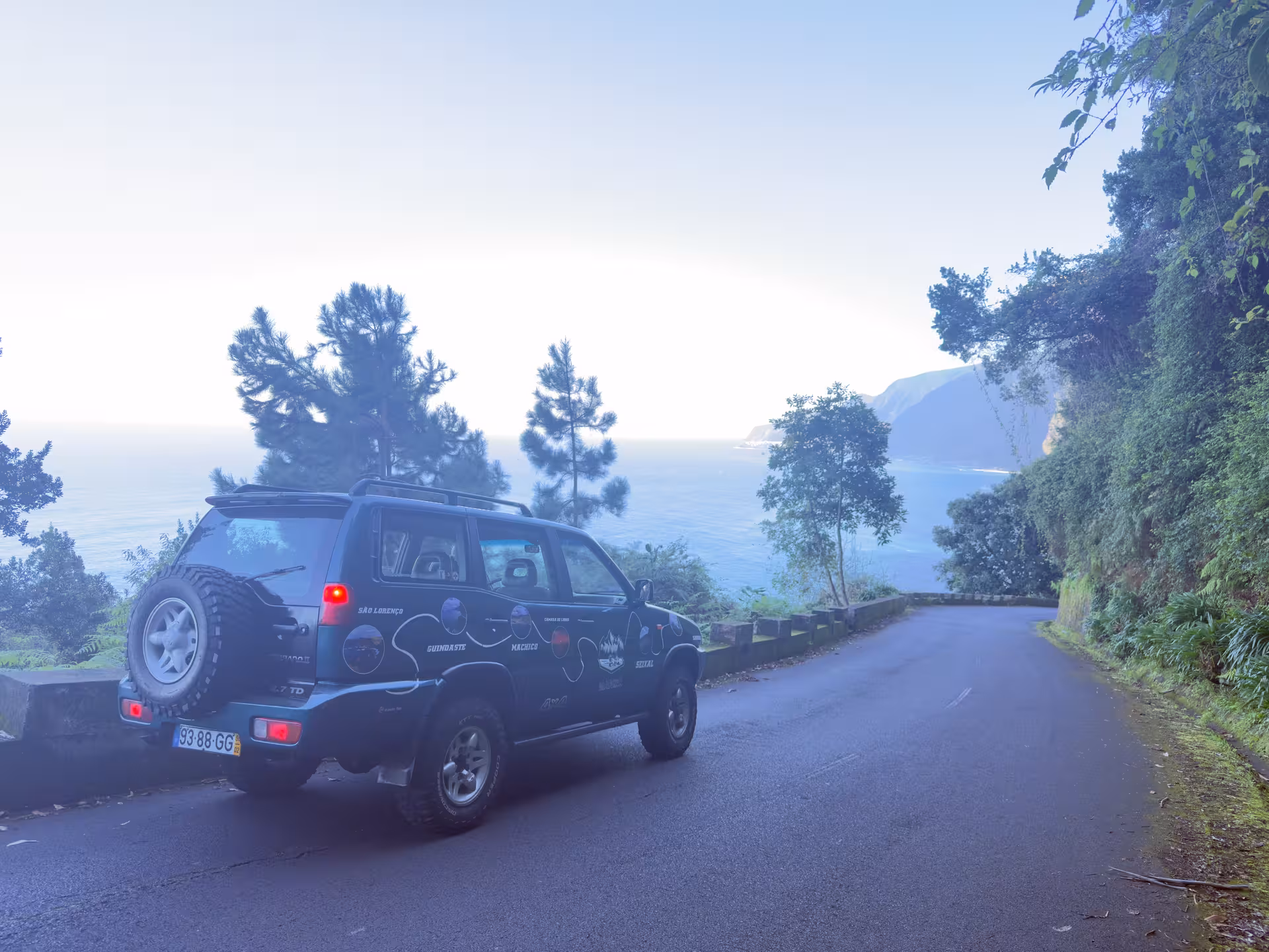 4x4 Experience North Wonders jeep on coastal mountain road with Atlantic views in São Miguel, Azores