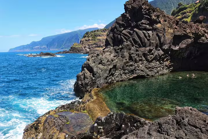 Explore rugged coastal beauty and crystal-clear natural pools on a thrilling 4x4 tour in Madeira's untouched northwest.