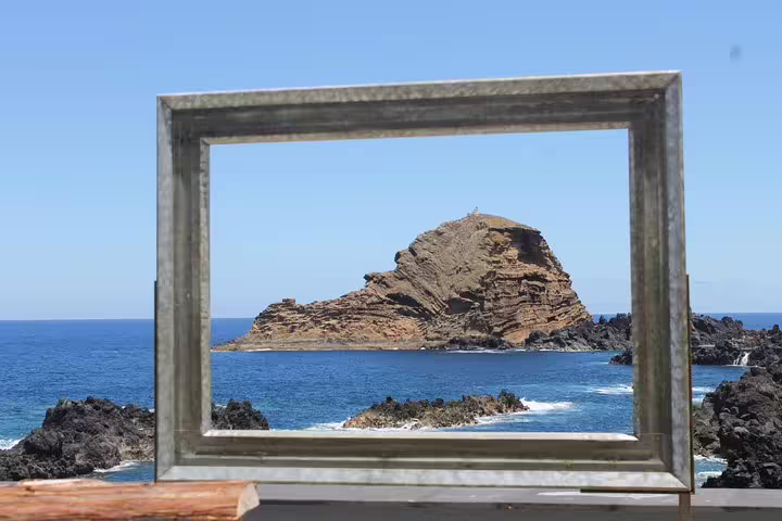 Rocky coastal view framed by an artistic border, highlighting Madeira's natural beauty on the Enchanted Terraces jeep tour.