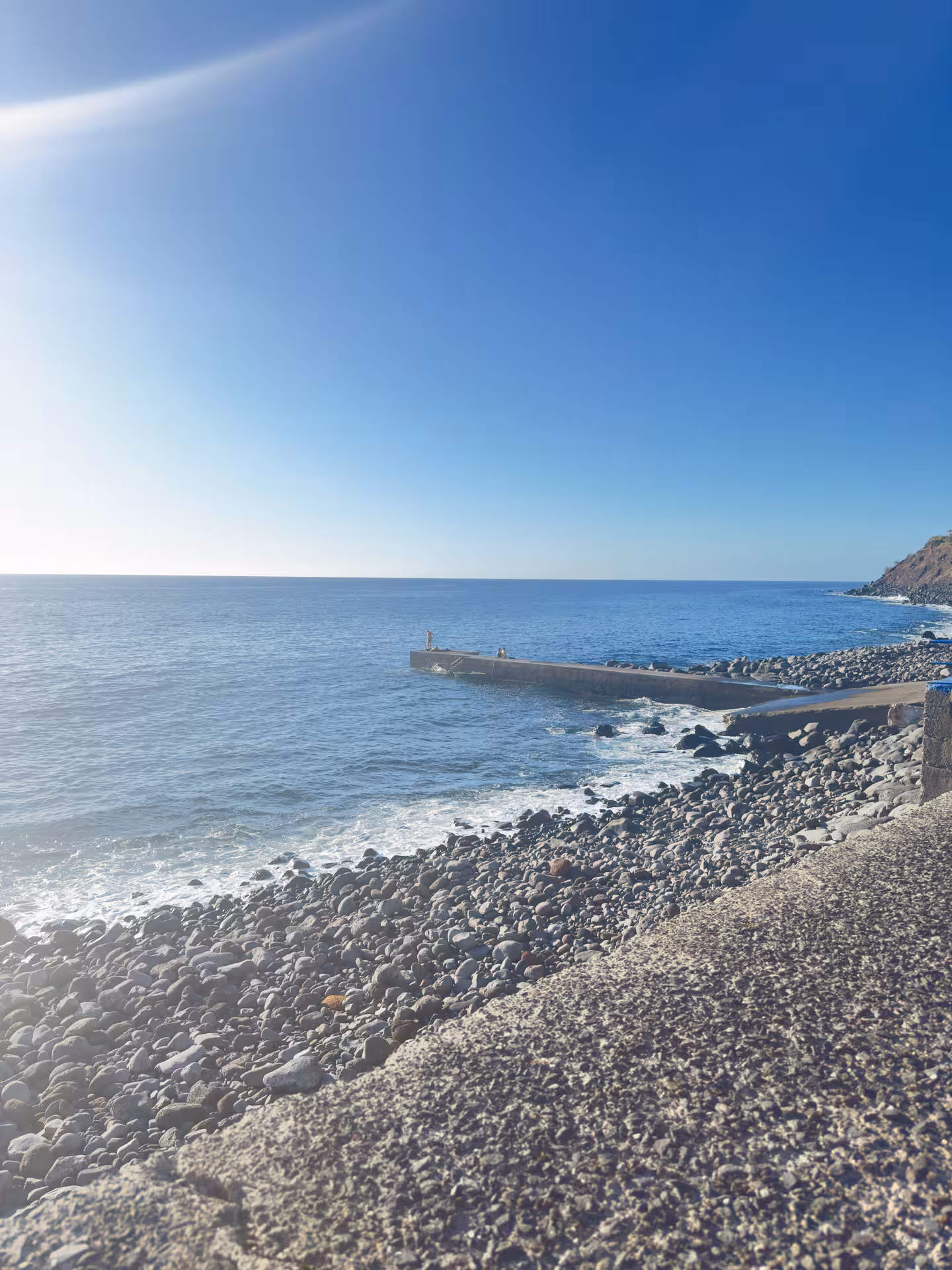 Rocky Atlantic shoreline and pier viewpoint on the 4x4 Experience North Wonders tour in São Miguel, Azores