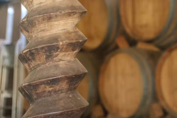 Close-up of rustic wooden barrels used for wine aging, highlighting the authentic Madeira wine experience on a 4x4 adventure tour.