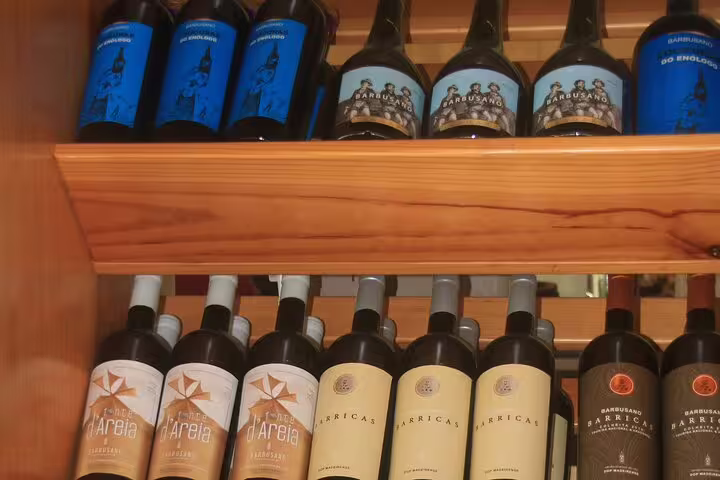 A selection of Madeira wines on display, perfect for savoring during the guided 4x4 adventure and skywalk with tapas.