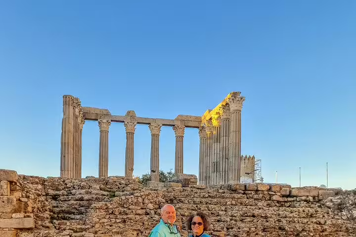 Ancient ruins of the Temple of Diana in Évora, Portugal, showcasing historic architecture on a sunny stopover from Madrid to Lisbon.
