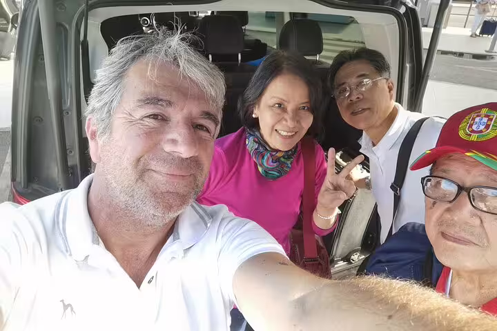 Group enjoying a Madrid to Lisbon private transfer with scenic stops, perfect for a comfortable and personalized travel experience.