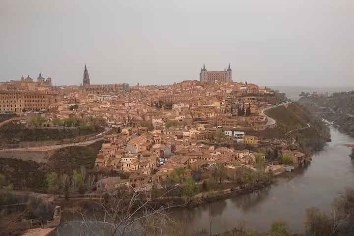 Scenic view of Toledo's historic architecture and river on a Madrid to Lisbon private transfer with cultural stops.