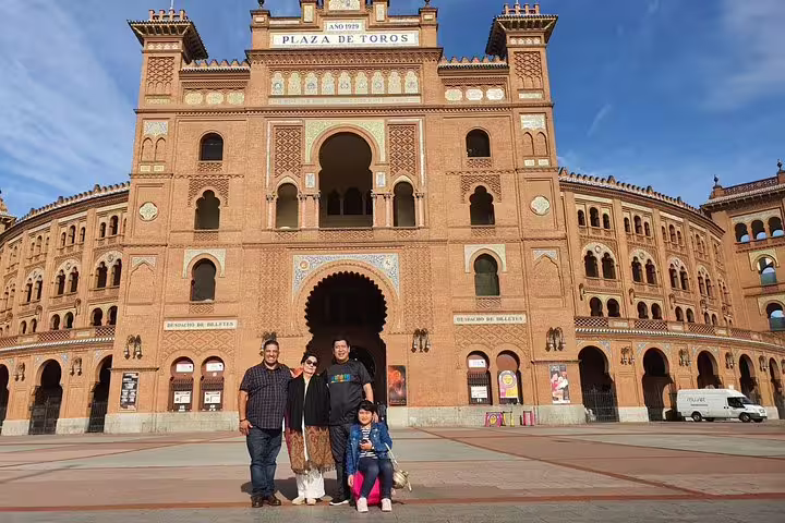 Family at Madrid Plaza de Toros outside Las Ventas, a photo stop on a private day trip to Toledo from Madrid