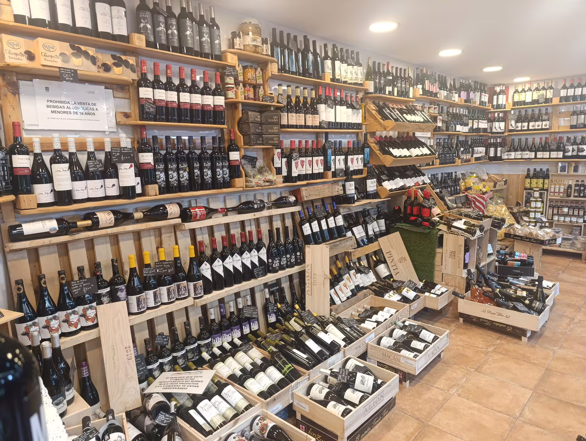 Extensive selection of Spanish wines in a Madrid shop, perfect for a city wine tour experience.