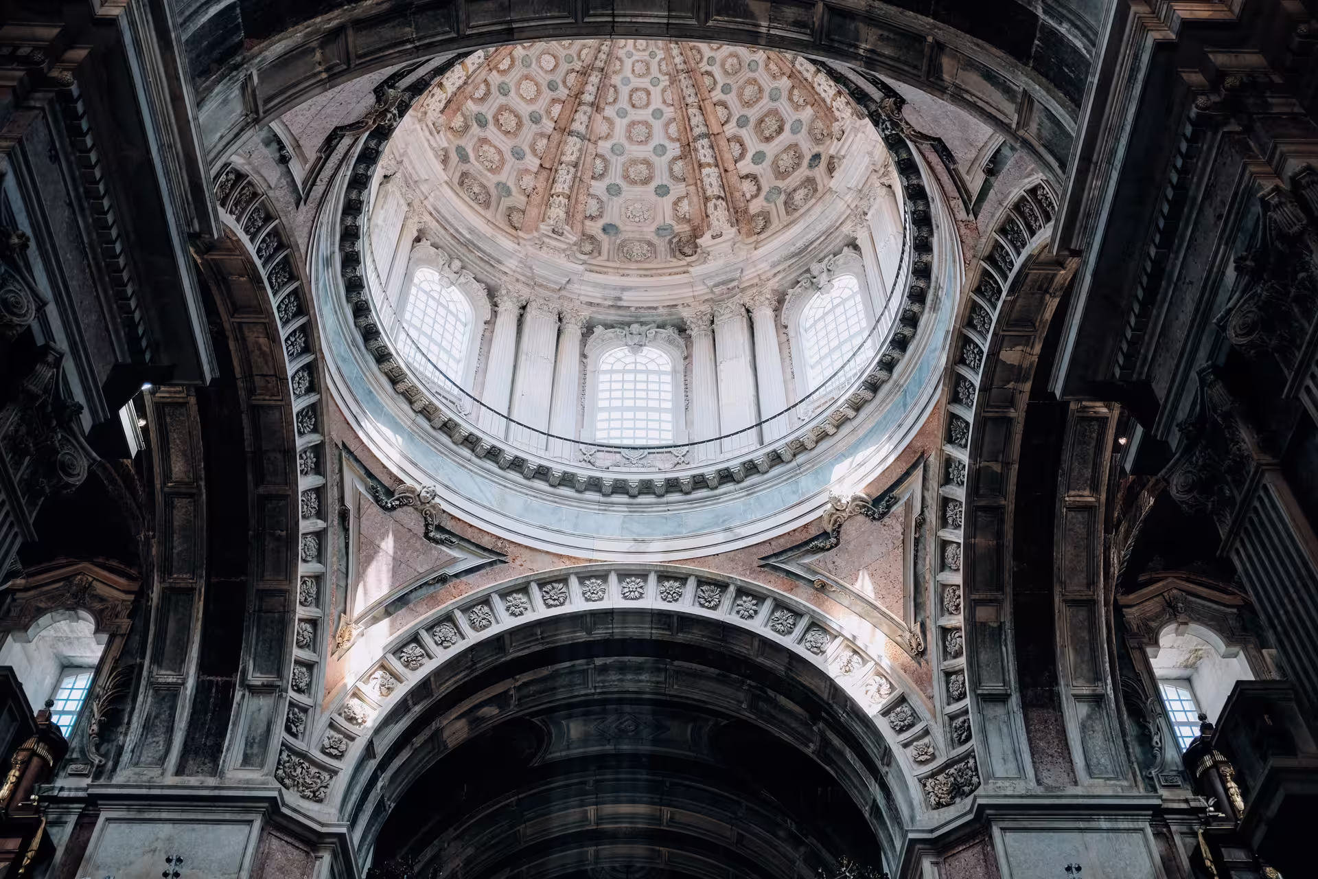 Intricate interior of Mafra National Palace dome, showcasing stunning architectural details on the Lisboa private day tour.