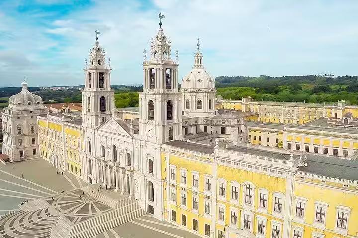 Aerial view of the grand Mafra National Palace, showcasing stunning Baroque architecture, featured in the Lisboa private day tour.