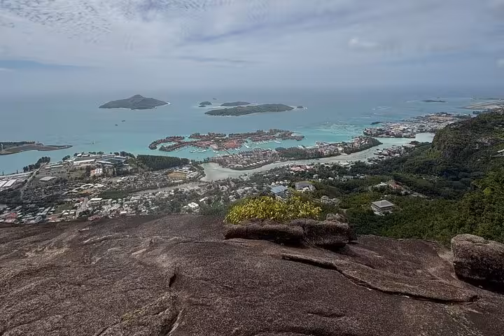 Breathtaking view from Mahe Island showcasing turquoise waters and lush landscapes perfect for private Seychelles tours.