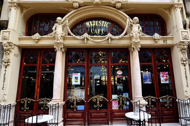Front view of the iconic Majestic Café in Porto, showcasing its ornate architecture and inviting outdoor seating.