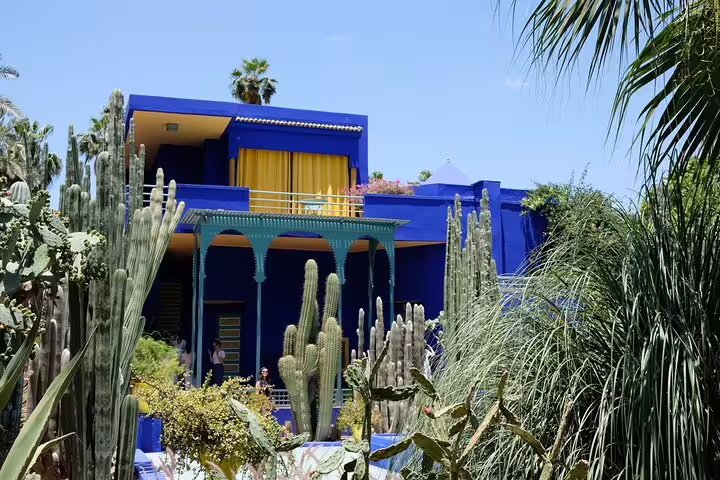 Majorelle Garden in Marrakech with the iconic blue villa and cacti, featured on a full-day local sightseeing tour