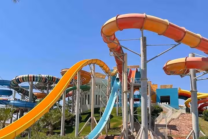 Colorful looping water slides at Makadi Water World Aqua Park, day use trip from Hurghada with lunch