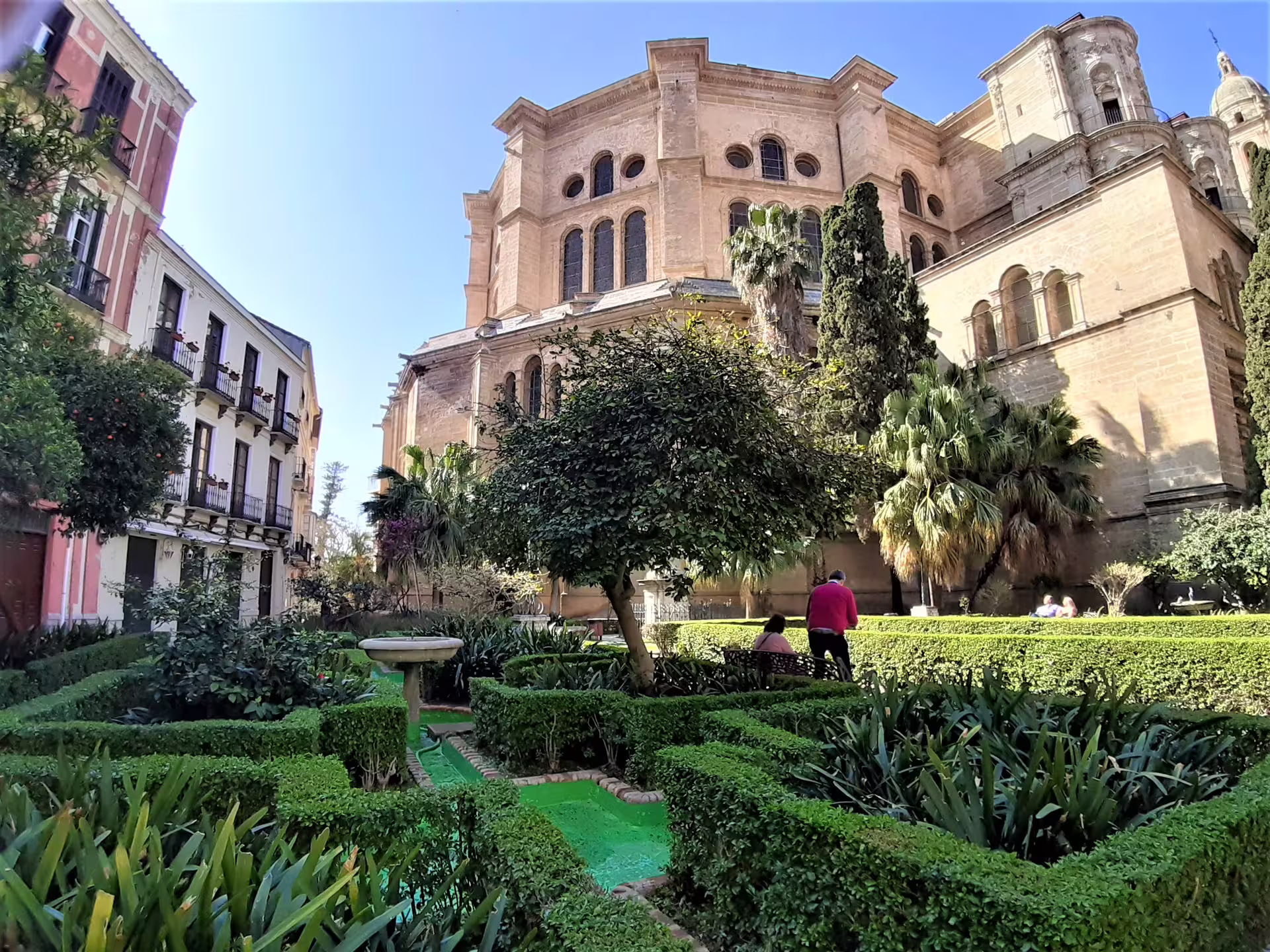 Malaga Cathedral and lush gardens in the historic center, stop on private full-day Malaga and Mijas tour