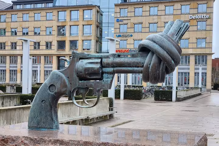 Non-Violence sculpture in Malmo city center, showcasing iconic knotted gun symbolizing peace on a guided tour.