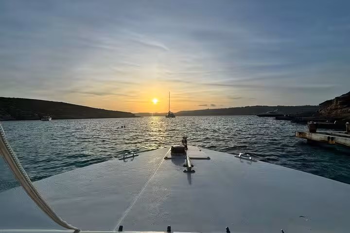Sunset boat view in Malta on the Gozo, Comino and Blue Lagoon Caves half-day cruise tour