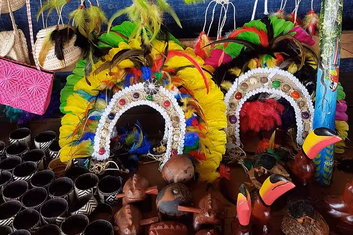 Colorful Amazon artisan market crafts and feather headdresses in Manaus, a highlight of the Manaus city tour