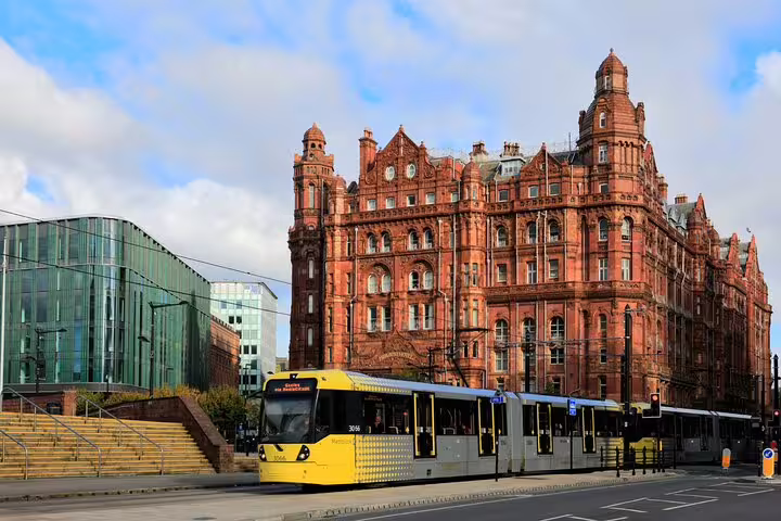 Manchester Metrolink tram by Midland Hotel and Central Library, featured on self-guided audio scavenger hunt