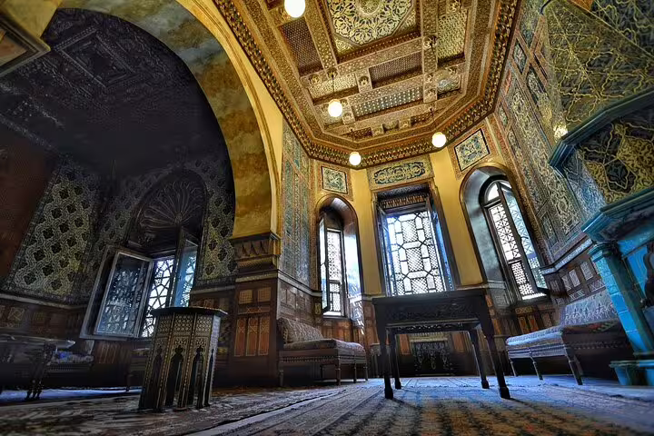 Ornate interior of Manial Palace in Cairo with Islamic mosaics and stained glass on a day tour