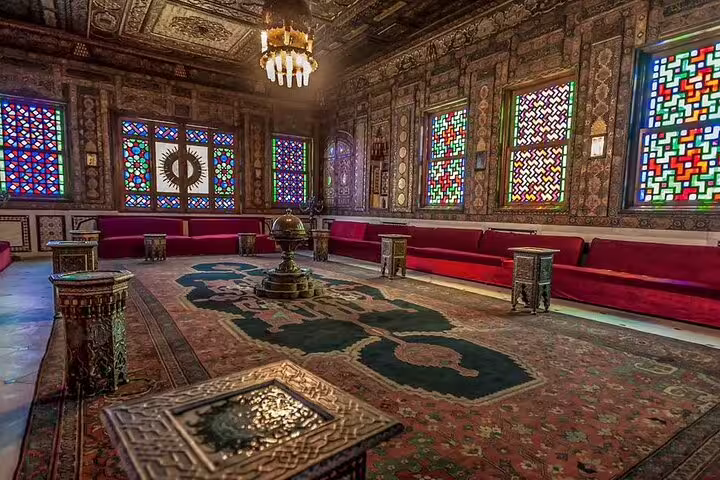Lavish Manial Palace interior with stained glass windows and carved ceilings, on a Cairo day tour with Cairo Tower