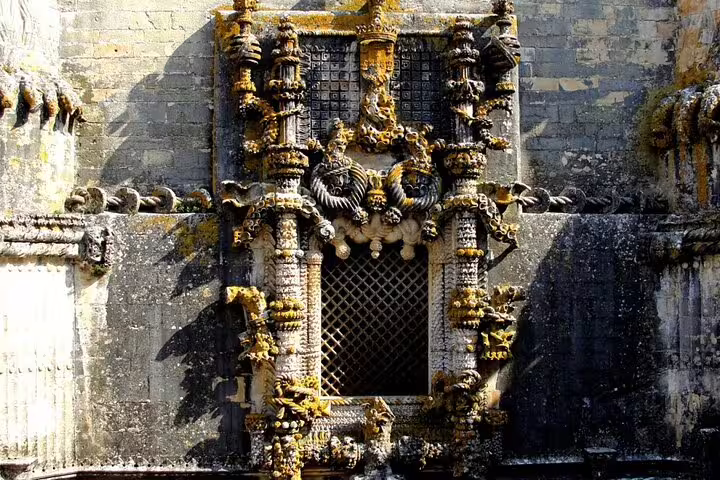 Intricate Manueline window detail at the Convent of Christ, a highlight of the Tomar and Almourol tour from Lisbon.