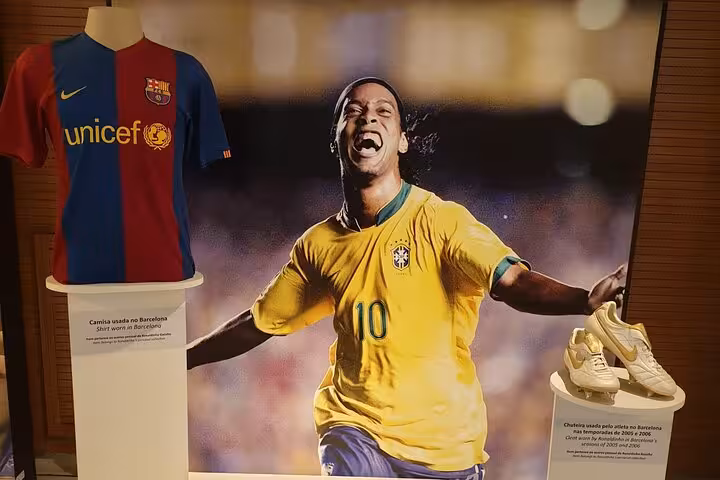 Maracanã Stadium tour exhibit featuring Brazil legend memorabilia and football boots in Rio de Janeiro