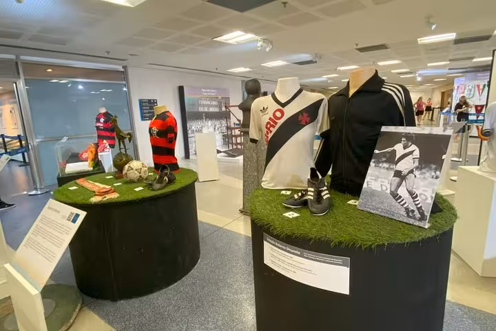 Maracanã Stadium tour museum exhibit with classic Rio football jerseys, boots and memorabilia on display