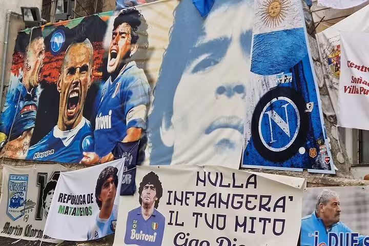 Maradona and Napoli banners at a shrine in Naples, iconic stop on Diego Maradona legacy tour with pizza tasting