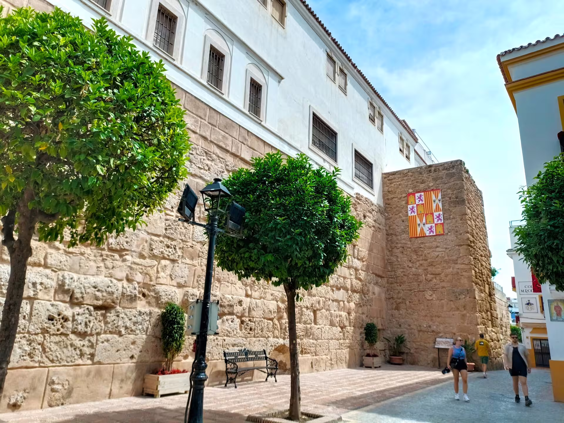 Historic Marbella Old Town wall and plaza stroll on private Marbella & Puerto Banus day trip with hotel pick-up