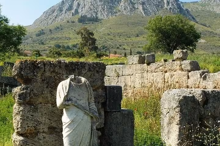 Headless marble statue among Ancient Corinth ruins on a private Athens and Biblical Corinth full-day tour