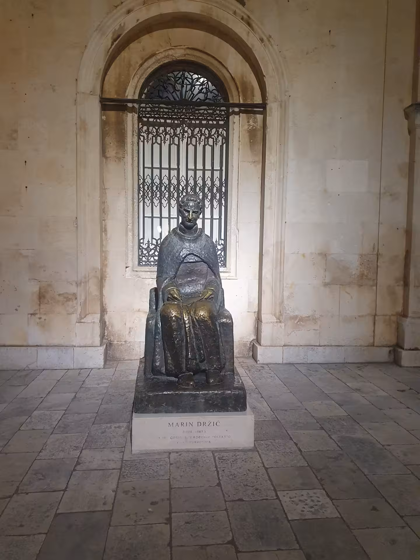 Marin Držić statue in Dubrovnik Old Town at night, cultural stop on the exclusive history by night tour