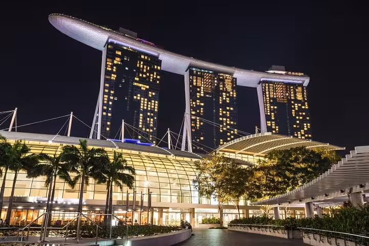 Marina Bay Sands illuminated at night, featuring its iconic architecture and vibrant Singapore cityscape backdrop.