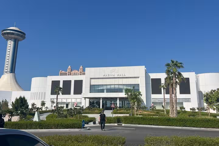 Marina Mall Abu Dhabi stop on Ras Al Khaimah to Abu Dhabi city tour, modern facade with observation tower